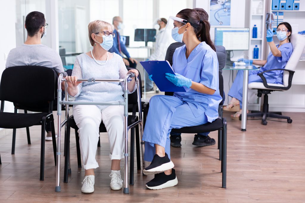 Handicapped senior woman with walking frame