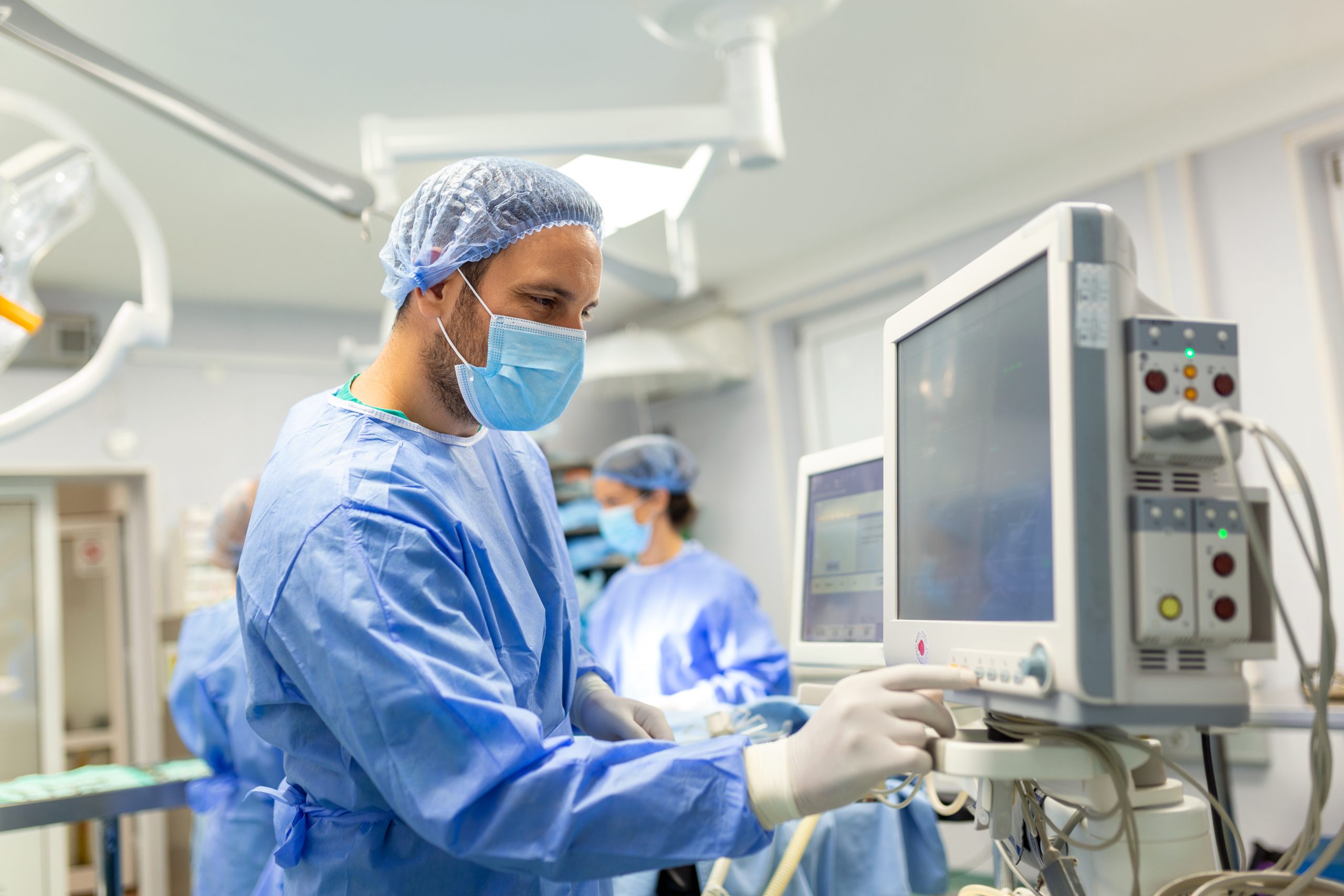 Medical ventilator being monitored by anaesthetist.