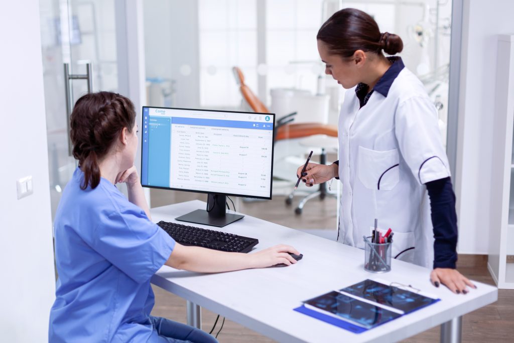 nurse checking patient appointment