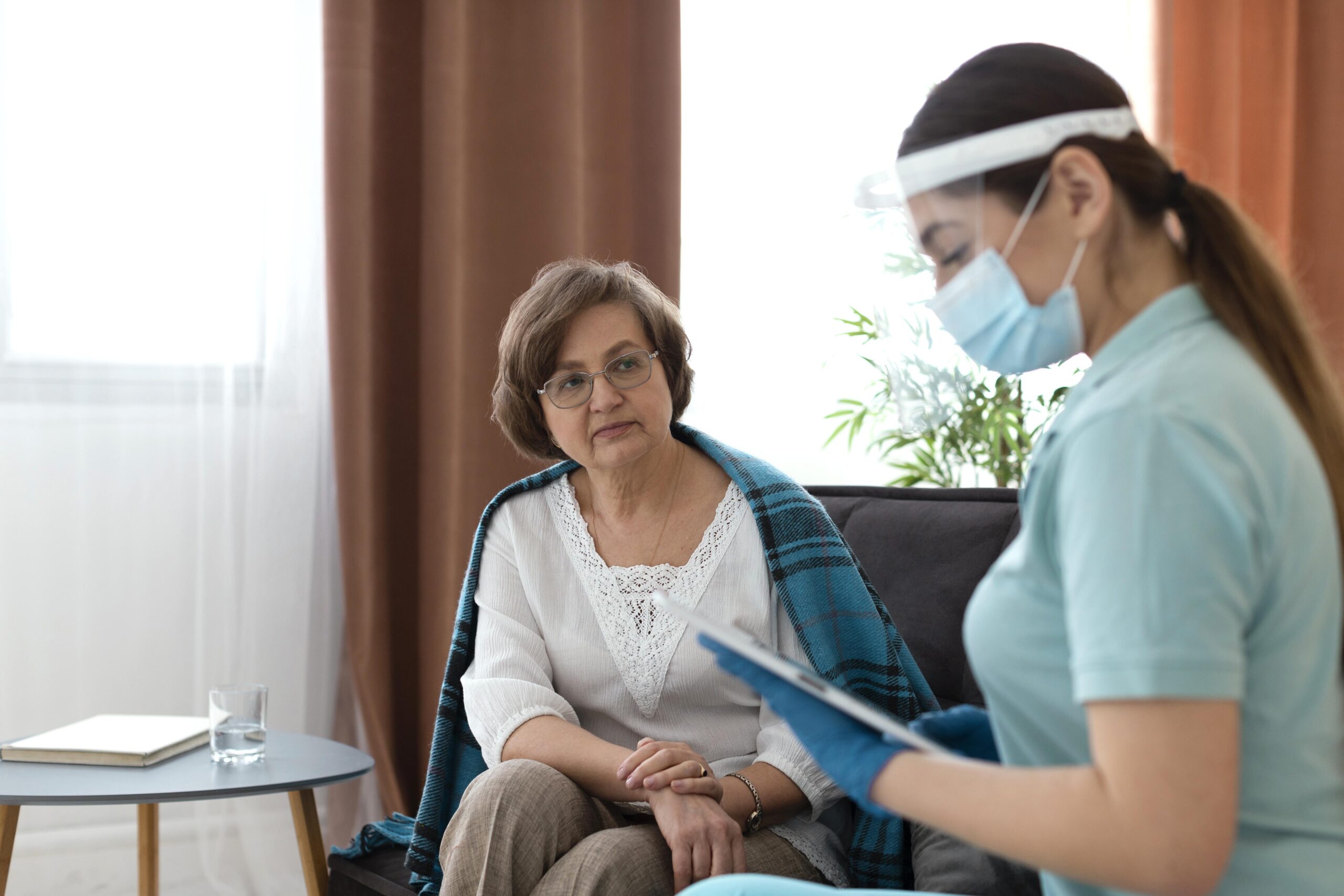 Doctor visiting patient at home